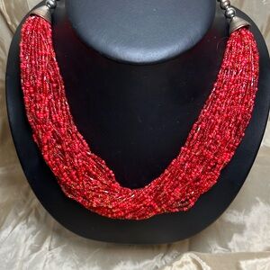 Red multi strand beaded necklace